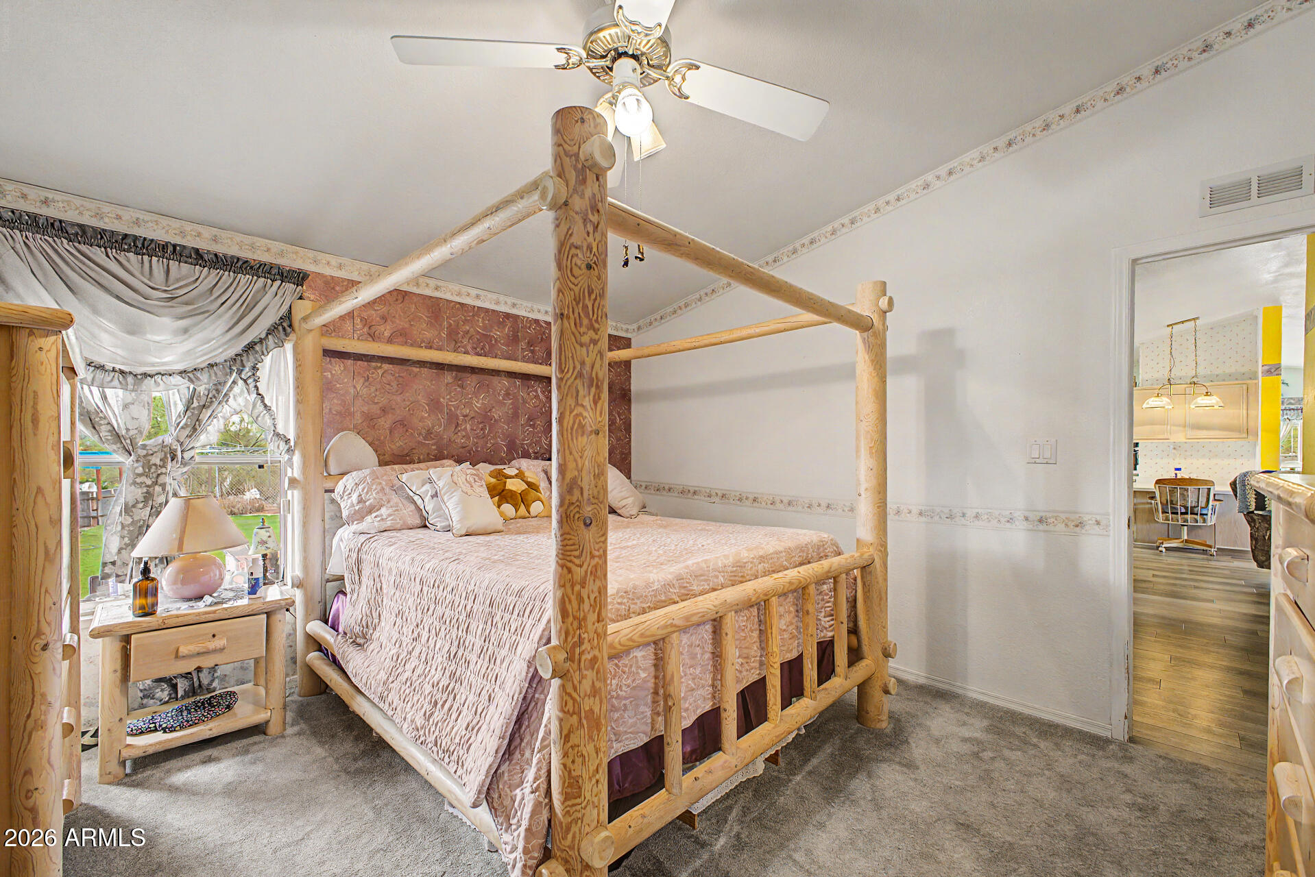 2548 South Val Vista Road Apache Junction, AZ 85119 - Photo 21 of 29 a bedroom with a bed next to a window