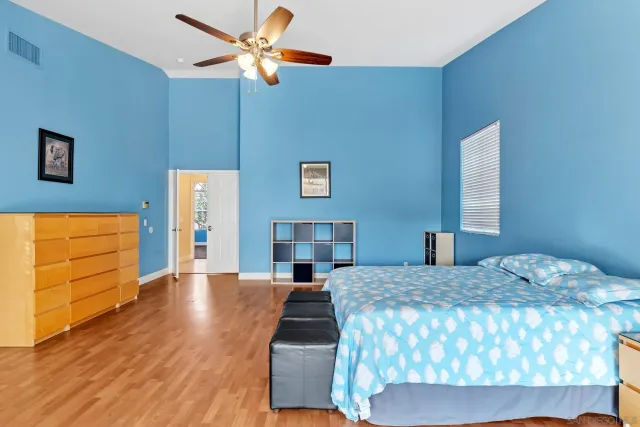 a bedroom with bed and window