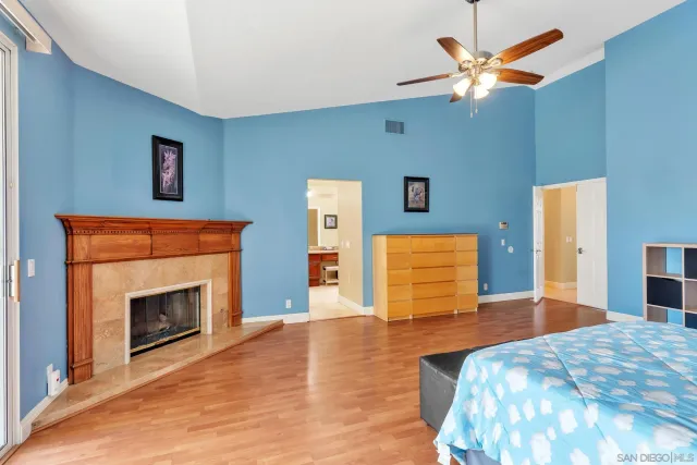 a bathroom with a granite countertop sink double vanity and a mirror