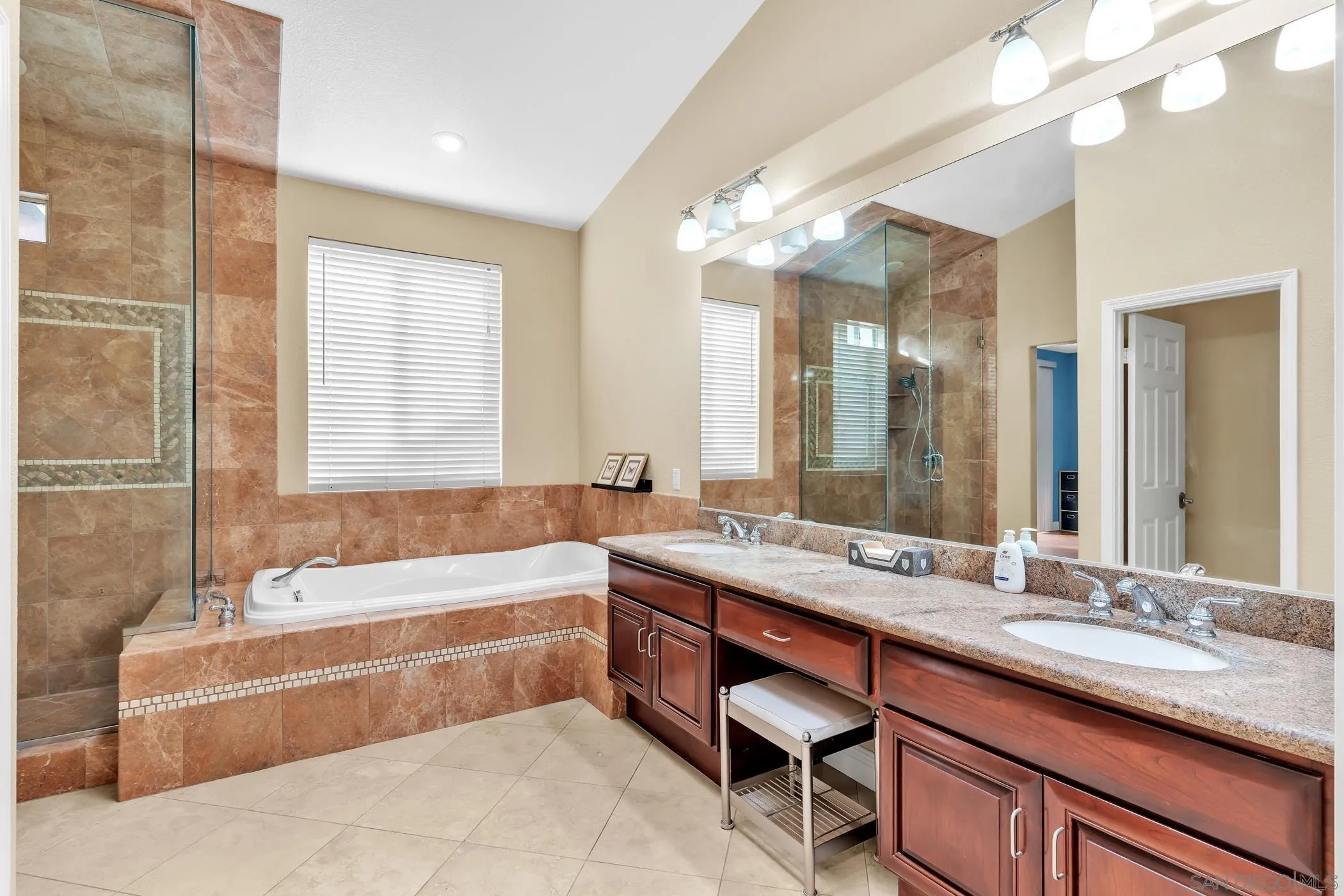 2389 Victoria Circle Alpine, CA 91901 - Photo 23 of 75 a bathroom with a granite countertop sink mirror and a bathtub