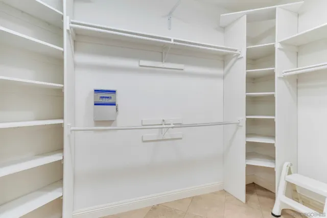 a living room with furniture and a lamp