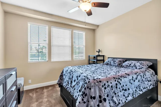 a living room with furniture and floor to ceiling window