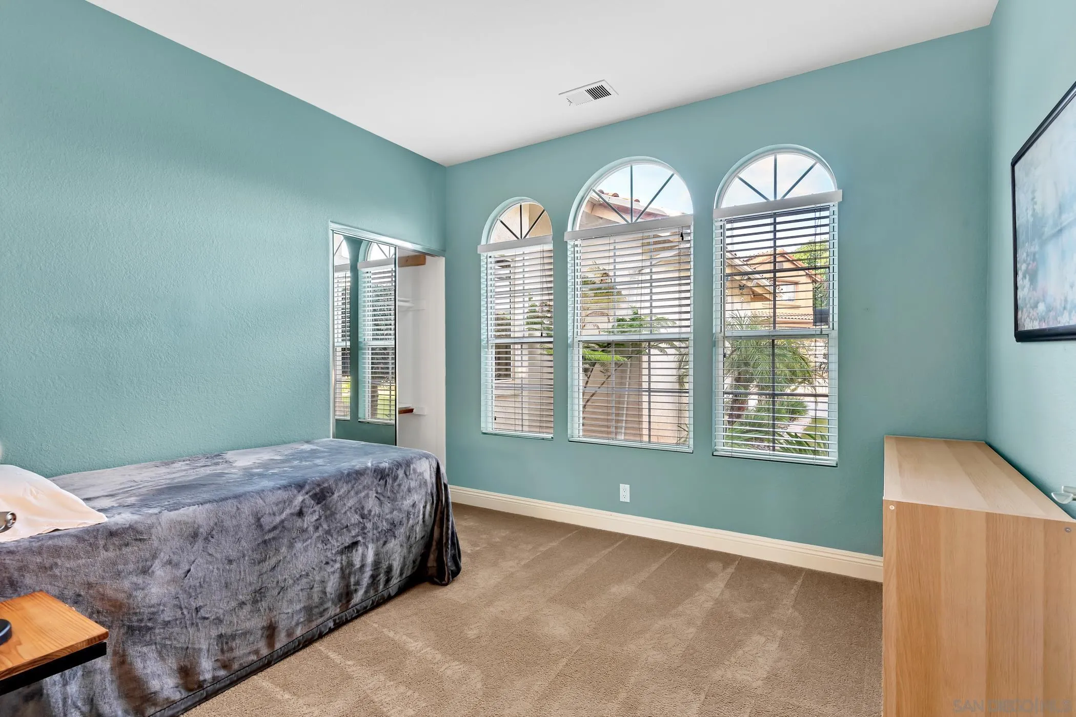 2389 Victoria Circle Alpine, CA 91901 - Photo 34 of 75 a living room with a bed furniture and a large window