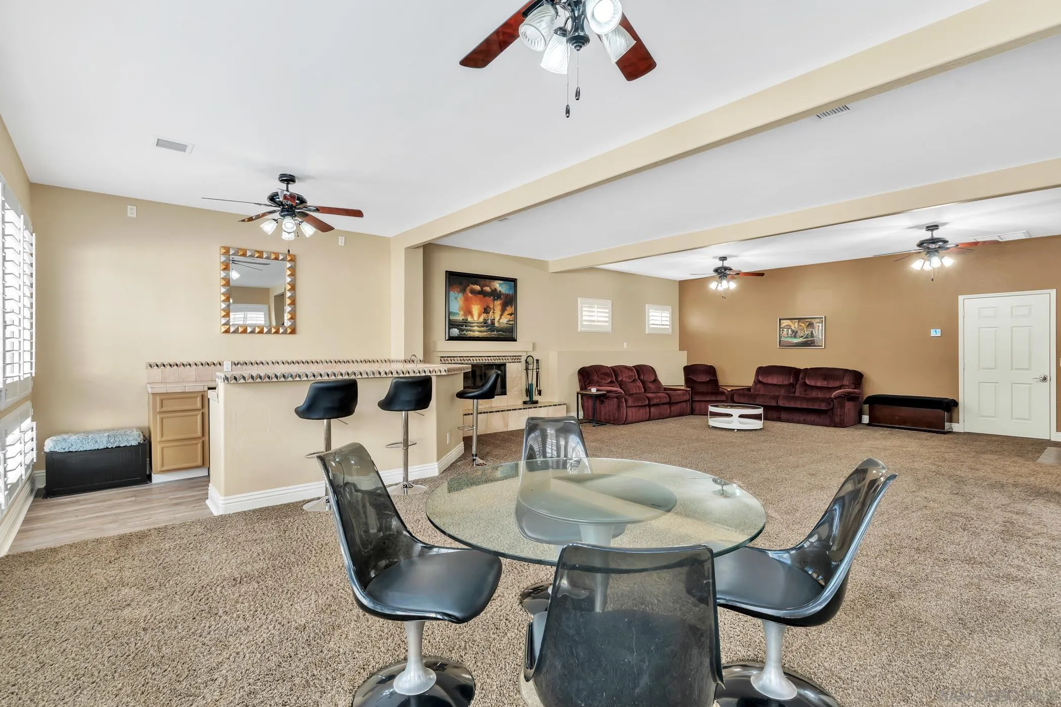 2389 Victoria Circle Alpine, CA 91901 - Photo 39 of 75 a living room with furniture a chandelier fan and a kitchen view