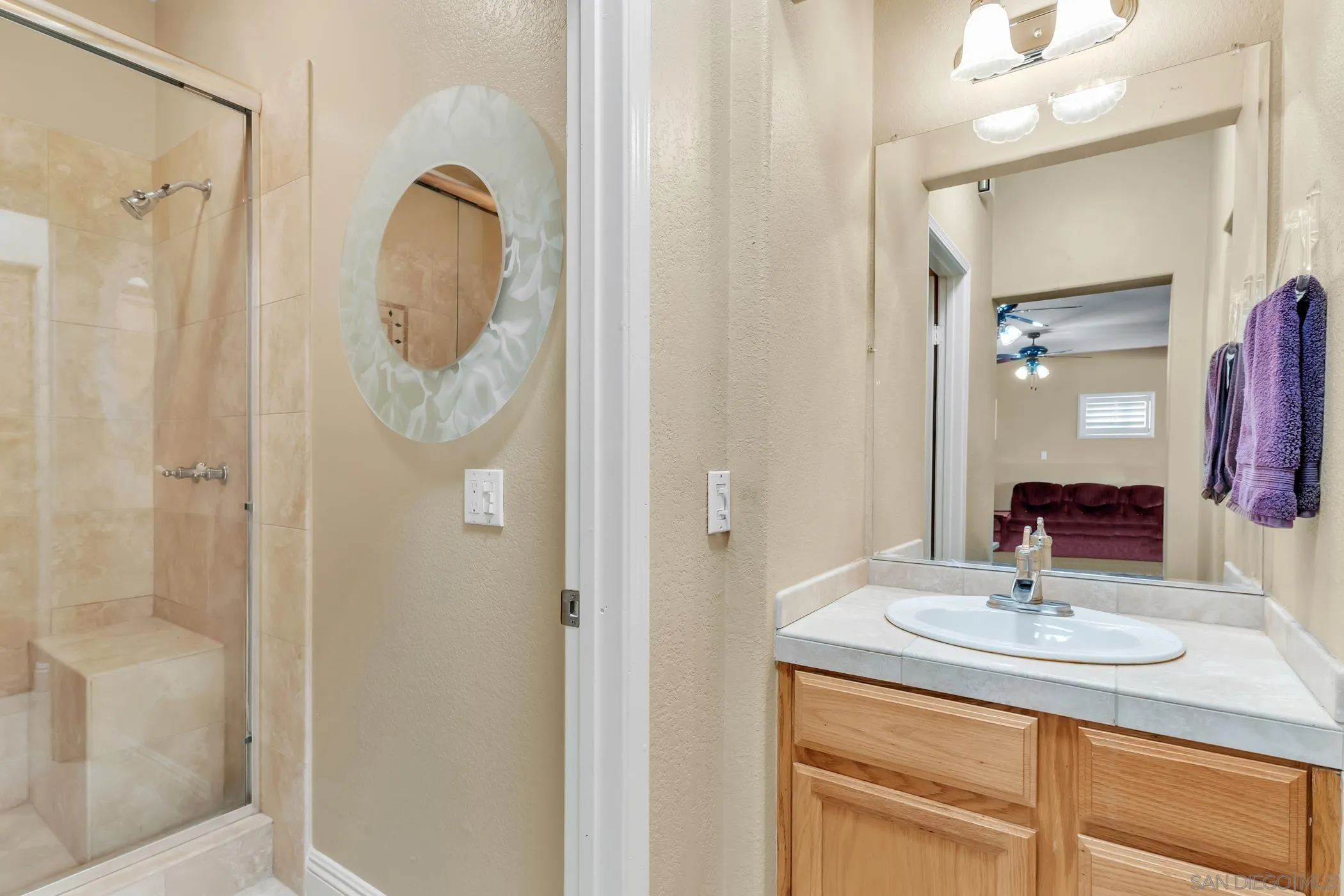 2389 Victoria Circle Alpine, CA 91901 - Photo 45 of 75 a bathroom with a sink vanity granite shower and a mirror