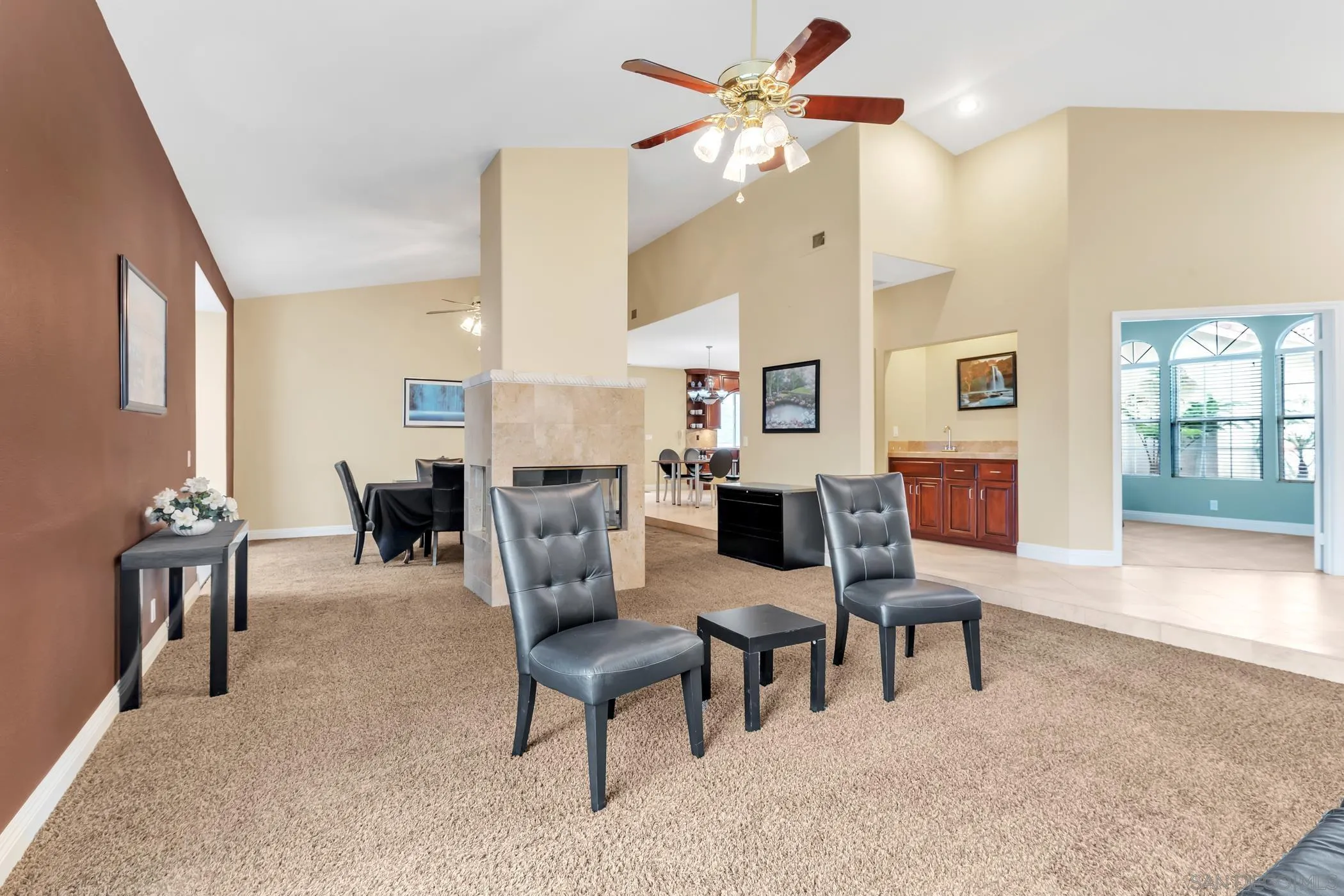 2389 Victoria Circle Alpine, CA 91901 - Photo 5 of 75 a living room with furniture a fireplace and a table
