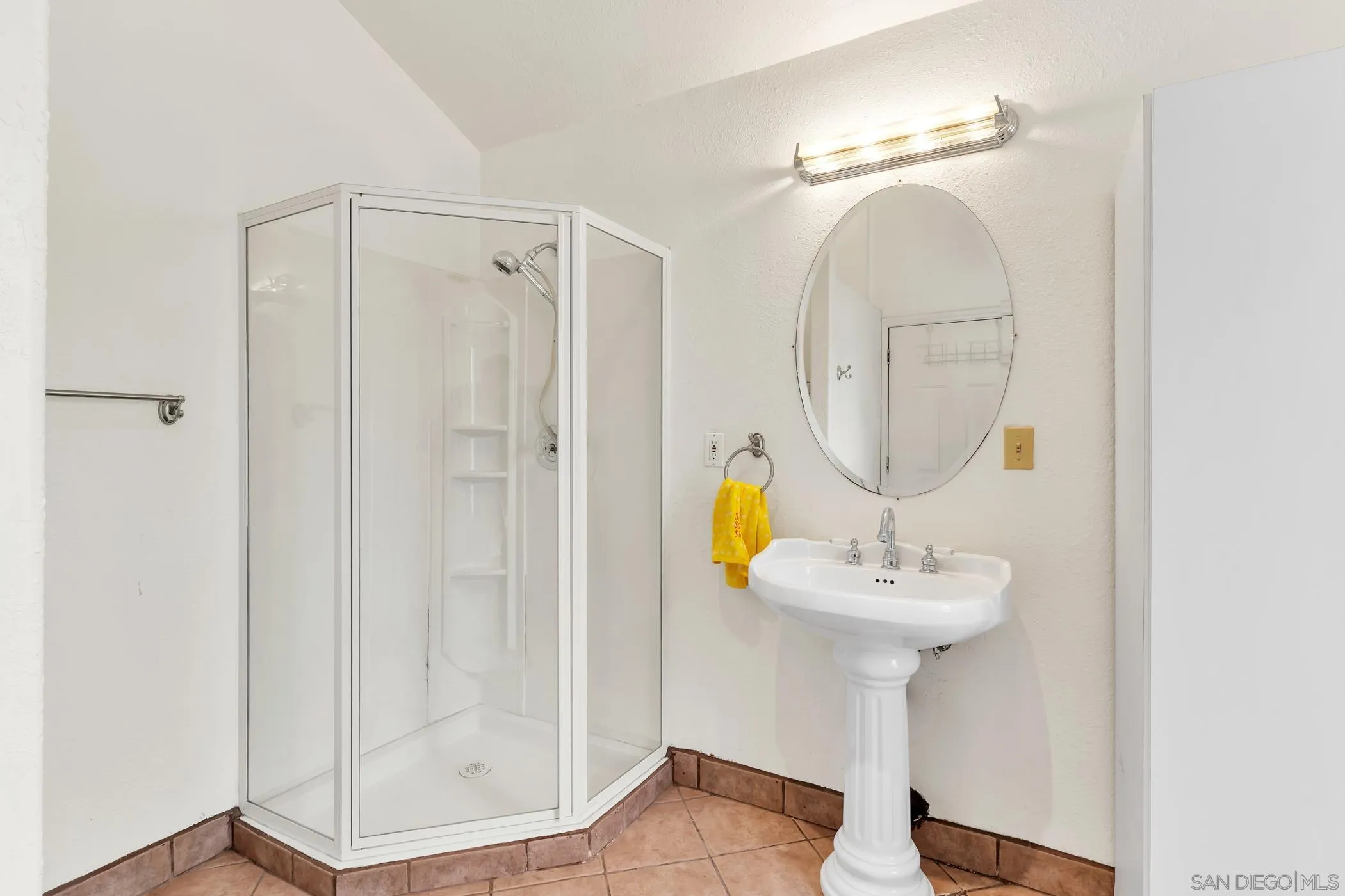 2389 Victoria Circle Alpine, CA 91901 - Photo 54 of 75 a bathroom with a sink a mirror and shower