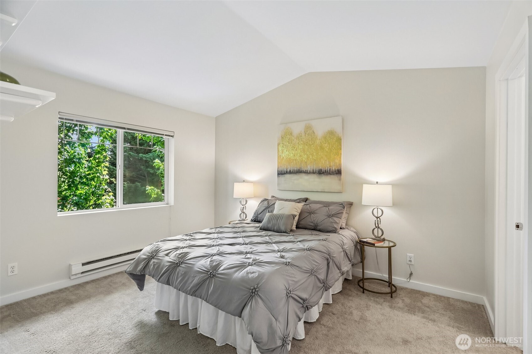 18930 Bothell Everett Highway, Unit E301 Bothell, WA 98012 - Photo 12 of 28 a bedroom with a bed and lamps