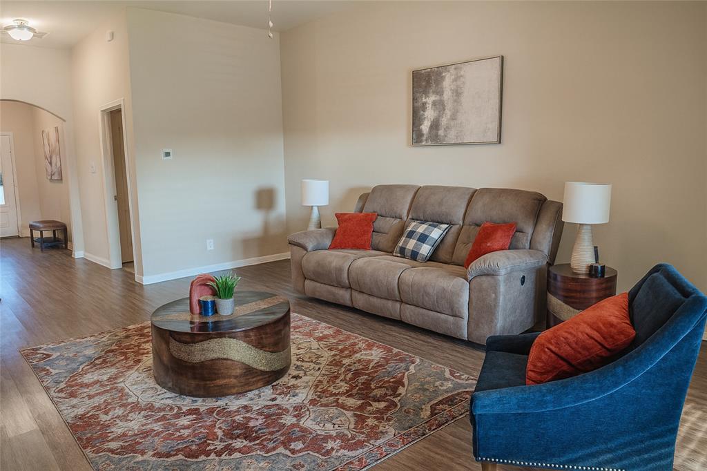 1837 Rialto Lane Crowley, TX 76036 - Photo 19 of 22 a living room with furniture and a potted plant