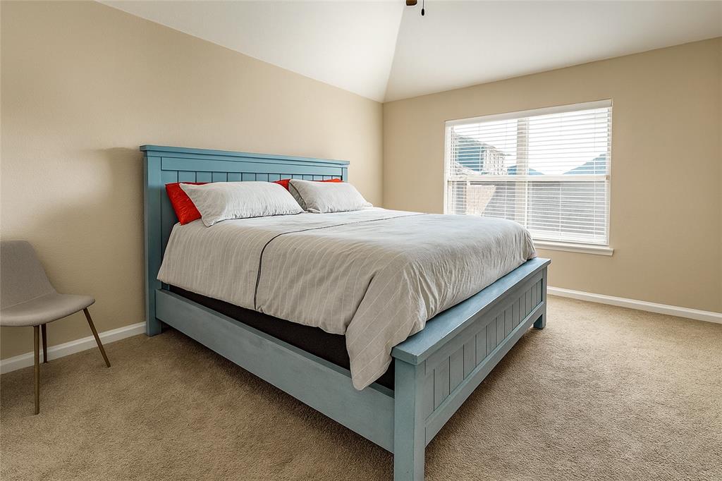 1837 Rialto Lane Crowley, TX 76036 - Photo 4 of 22 a bed sitting in a bedroom next to a window