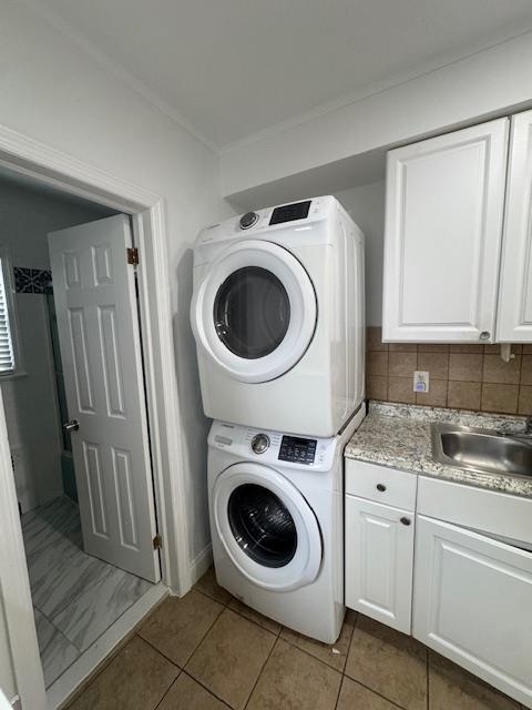 212 68th Street, Unit 1 Guttenberg, NJ 07093 - Photo 12 of 12 a utility room with sink dryer and washer