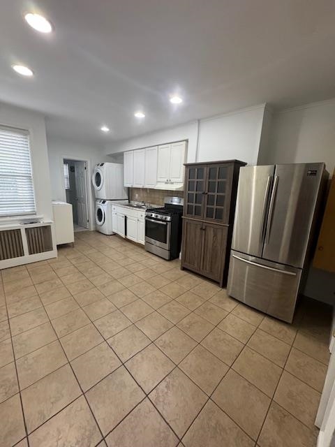 212 68th Street, Unit 1 Guttenberg, NJ 07093 - Photo 3 of 12 a kitchen with stainless steel appliances a refrigerator and a stove top oven