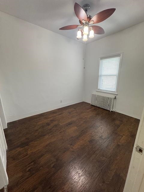 212 68th Street, Unit 1 Guttenberg, NJ 07093 - Photo 9 of 12 an empty room with wooden floor fan and windows