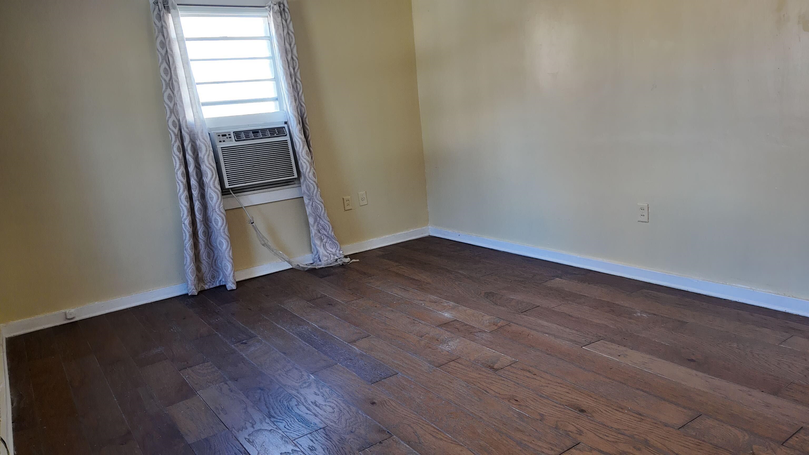 237 Modder Avenue Memphis, TN 38109 - Photo 11 of 19 a view of a room with wooden floor and door