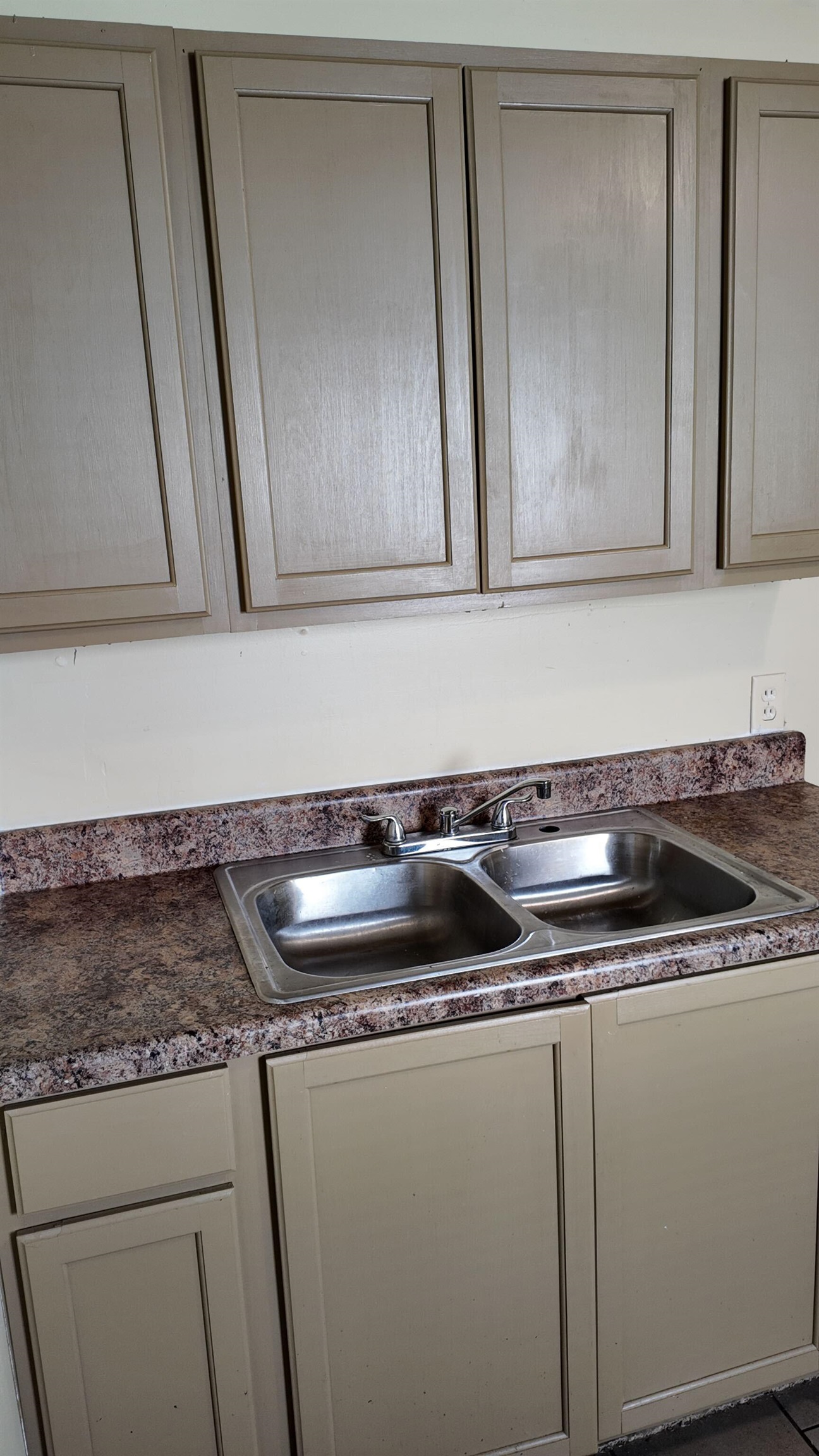 237 Modder Avenue Memphis, TN 38109 - Photo 16 of 19 a kitchen with a sink and cabinets