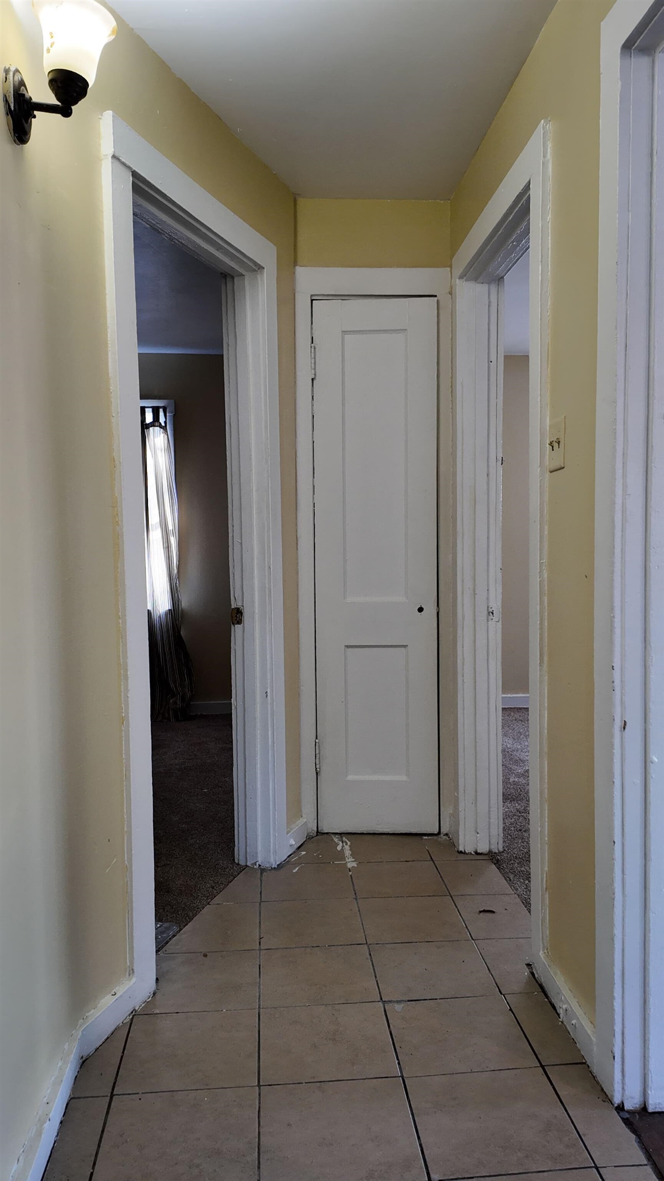 237 Modder Avenue Memphis, TN 38109 - Photo 18 of 19 a view of a hallway with wooden shelves