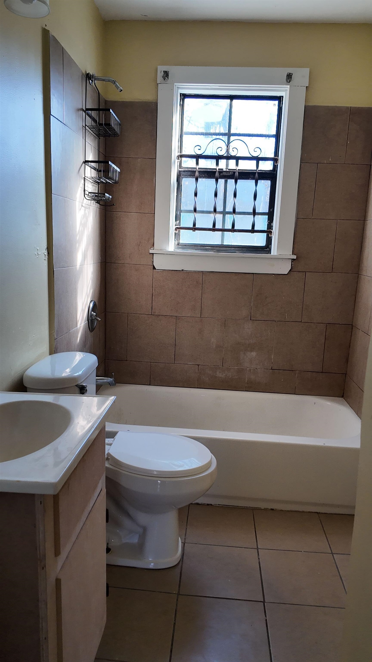 237 Modder Avenue Memphis, TN 38109 - Photo 19 of 19 a bathroom with a sink a toilet and bathtub