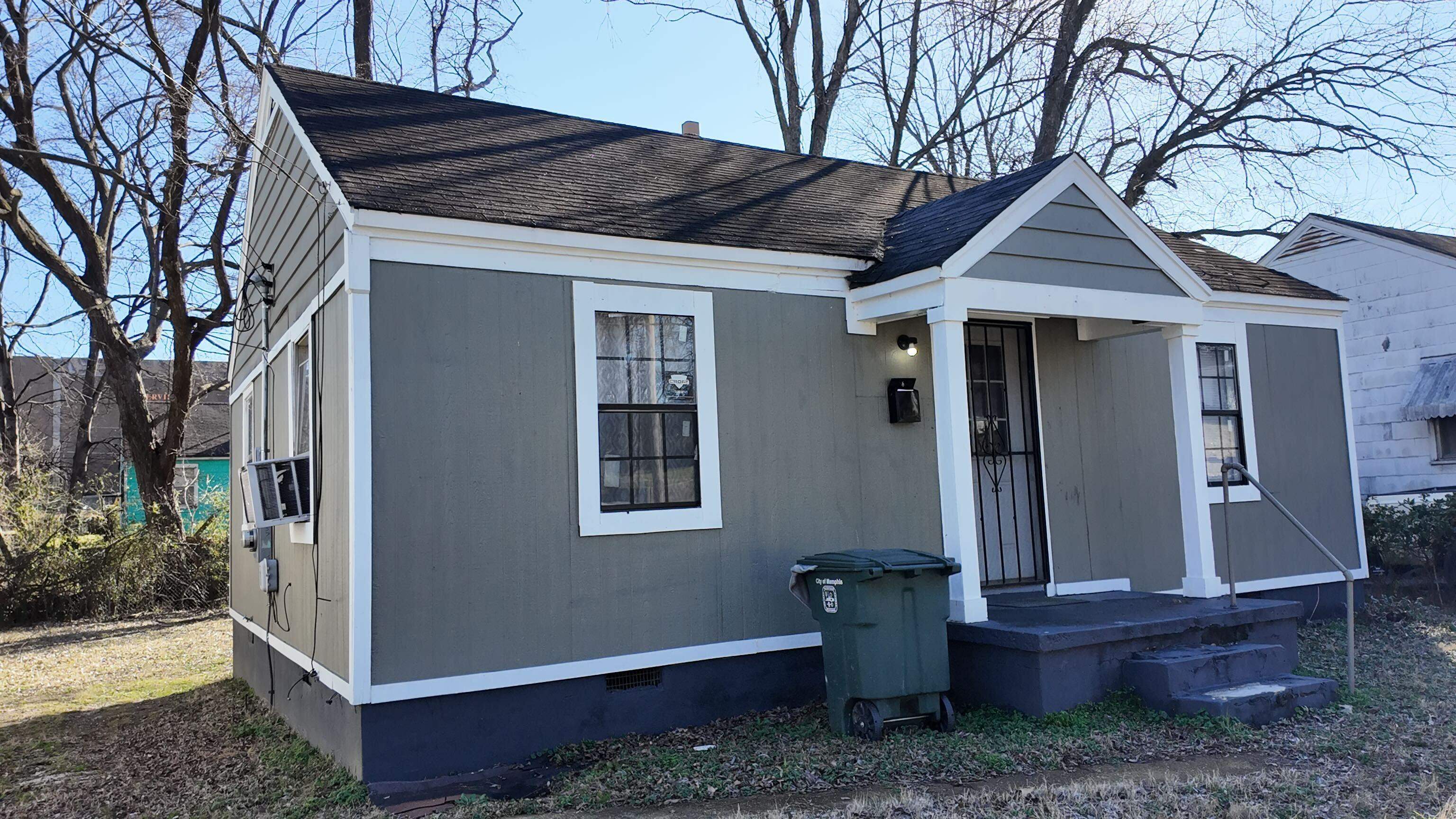 237 Modder Avenue Memphis, TN 38109 - Photo 4 of 19 a view of a small house with a yard