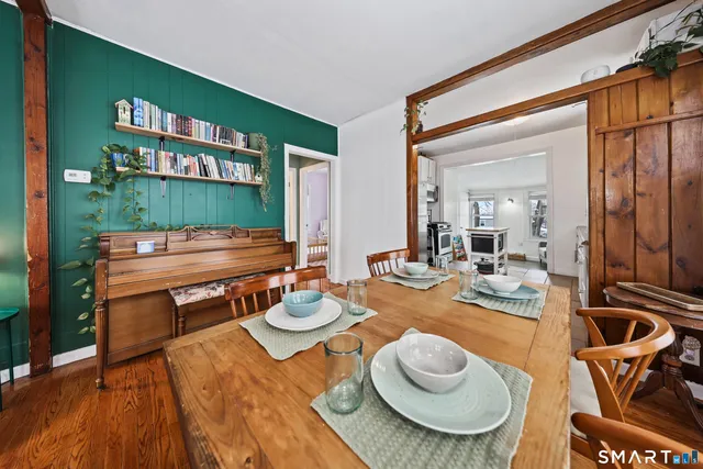 a outdoor dining space with furniture and rug