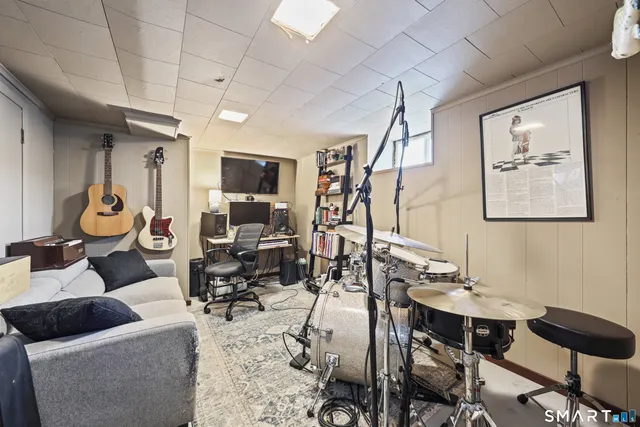 a view of a livingroom with furniture and a window