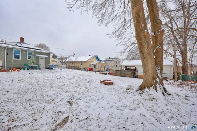 a view of outdoor space with deck and barbeque oven