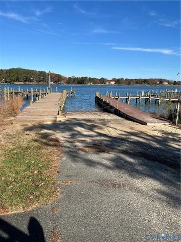 a view of a lake with houses in the back