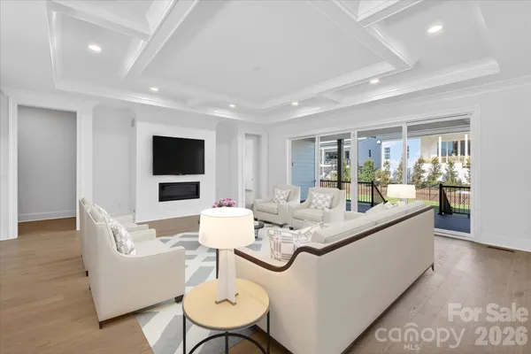 a living room with fireplace furniture and a flat screen tv