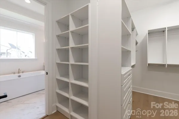 a bathroom with a bathtub and a window