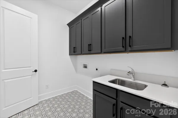 a kitchen with a sink and cabinets