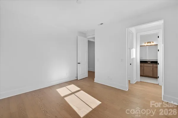 a view of an empty room and a window