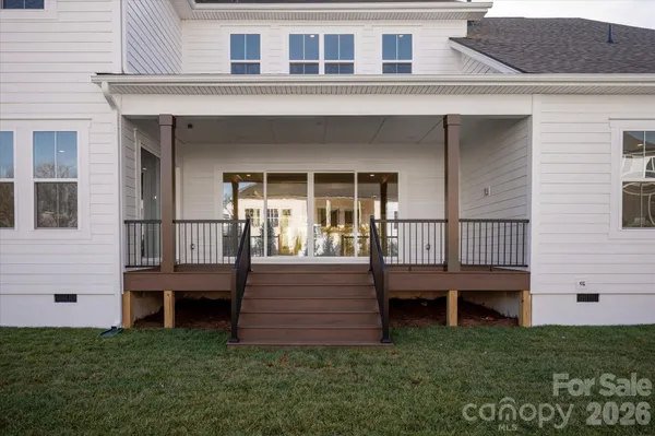 a view of backyard with deck