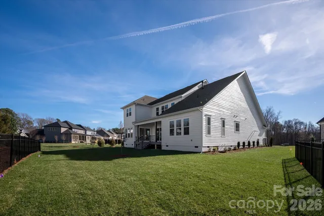 a view of house with yard and entertaining space