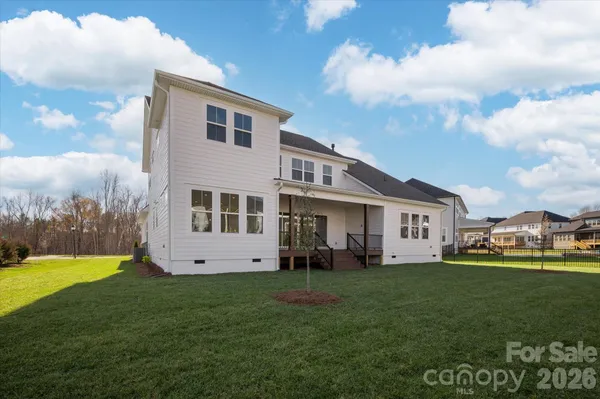 a front view of house with yard and outdoor seating