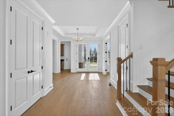 a view of an entryway with wooden floor