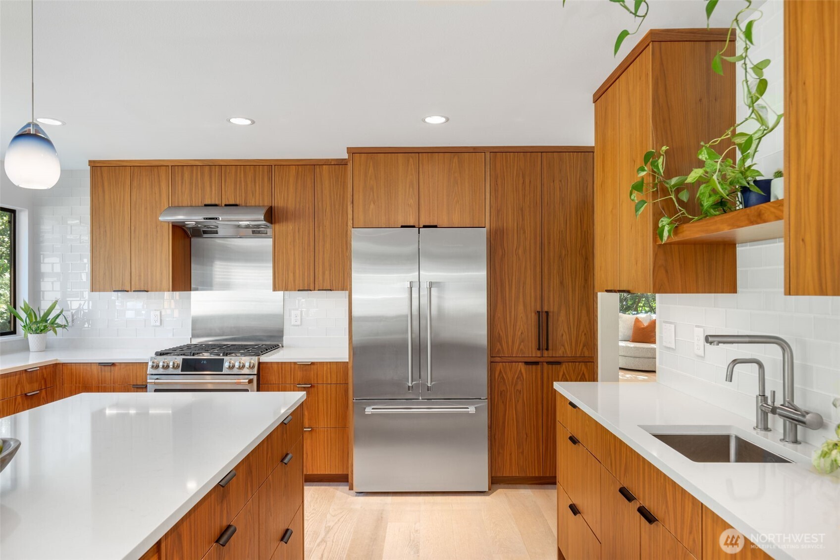 6667 Northeast Windermere Road Seattle, WA 98115 - Photo 13 of 40 a kitchen with granite countertop a sink stainless steel appliances and cabinets