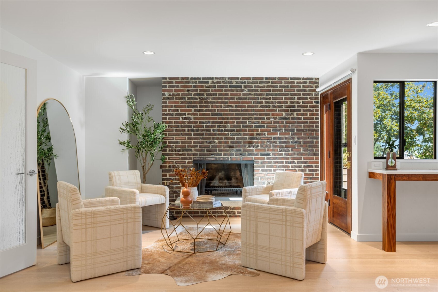 6667 Northeast Windermere Road Seattle, WA 98115 - Photo 14 of 40 a living room with furniture and a fireplace