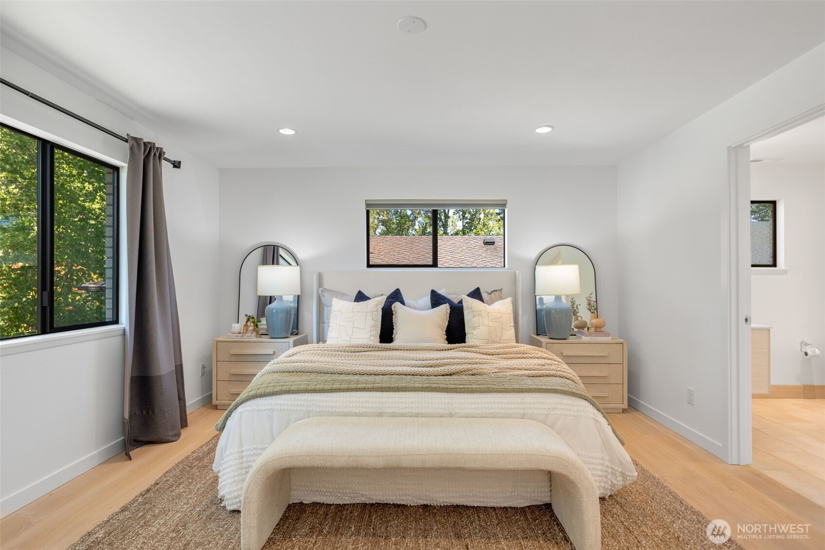 6667 Northeast Windermere Road Seattle, WA 98115 - Photo 16 of 40 a bed room with a bed and a large window