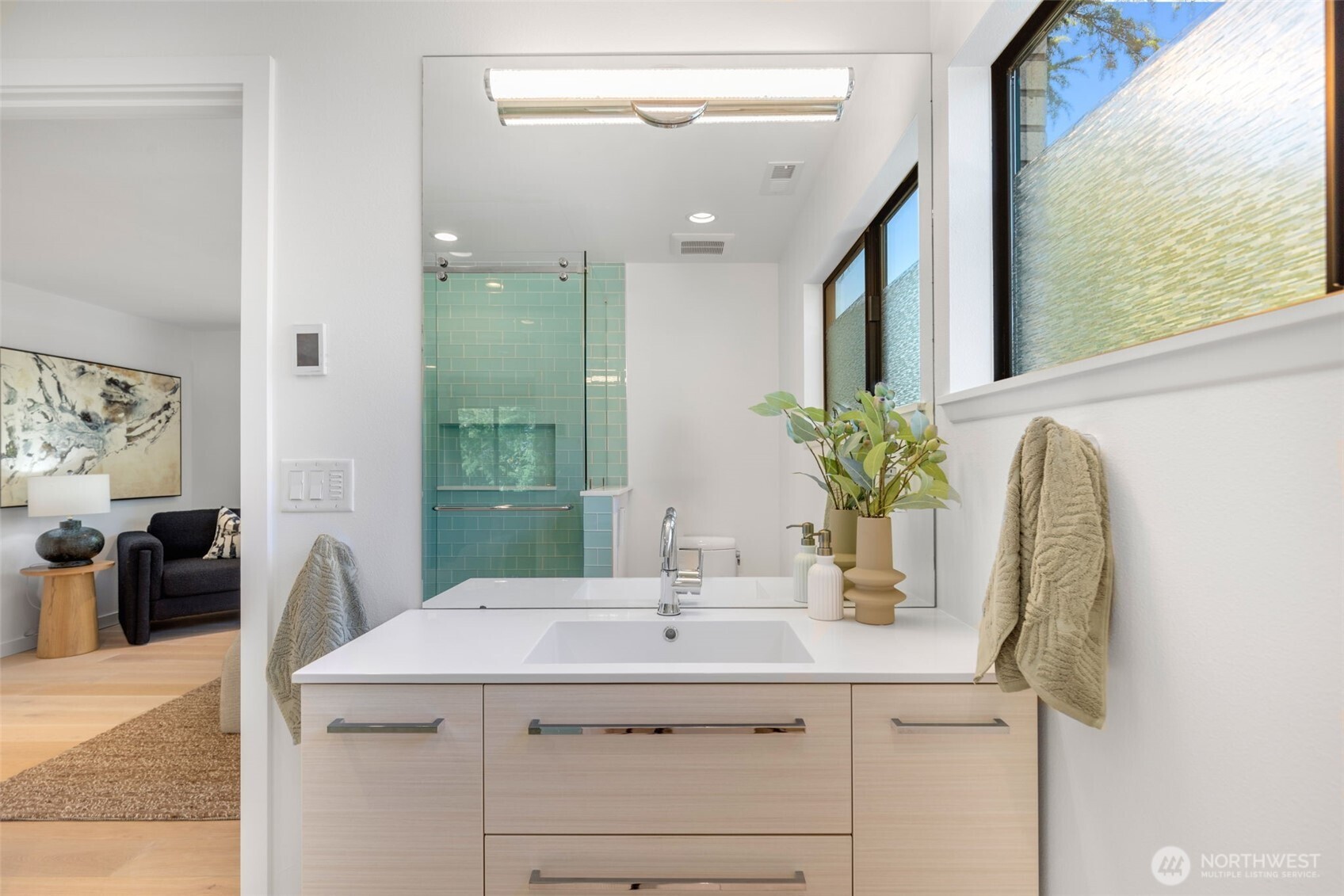 6667 Northeast Windermere Road Seattle, WA 98115 - Photo 19 of 40 a bathroom with a granite countertop sink a large mirror and a shower