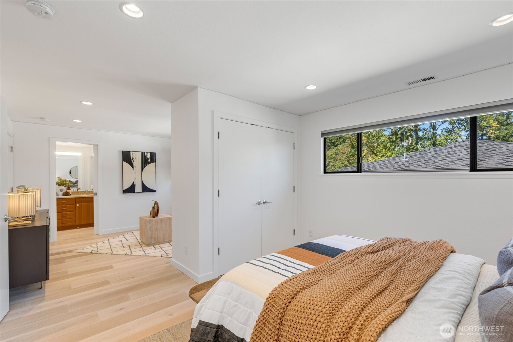 6667 Northeast Windermere Road Seattle, WA 98115 - Photo 21 of 40 a bedroom with a bed and a large window