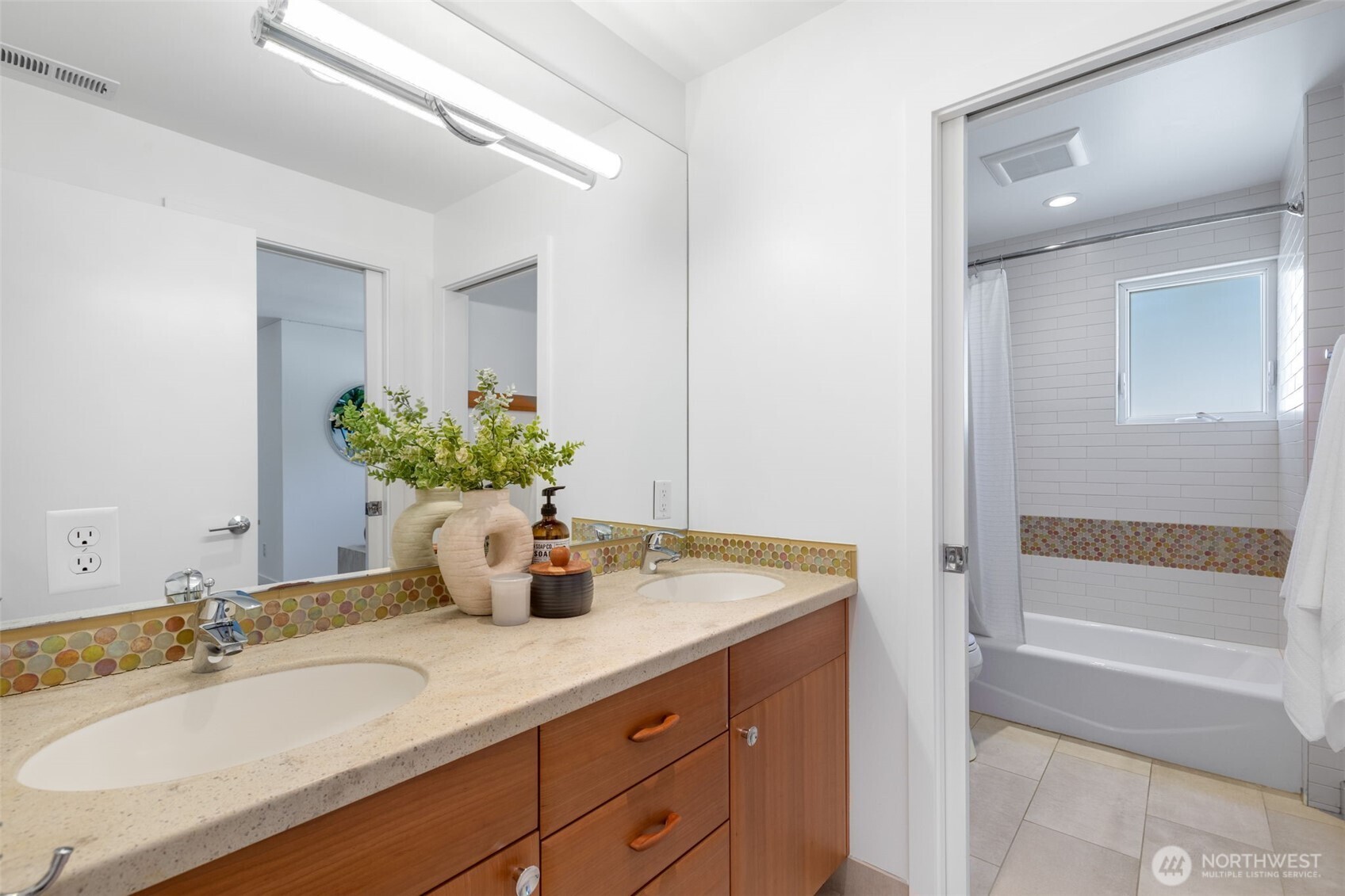 6667 Northeast Windermere Road Seattle, WA 98115 - Photo 22 of 40 a bathroom with a granite countertop sink and a mirror