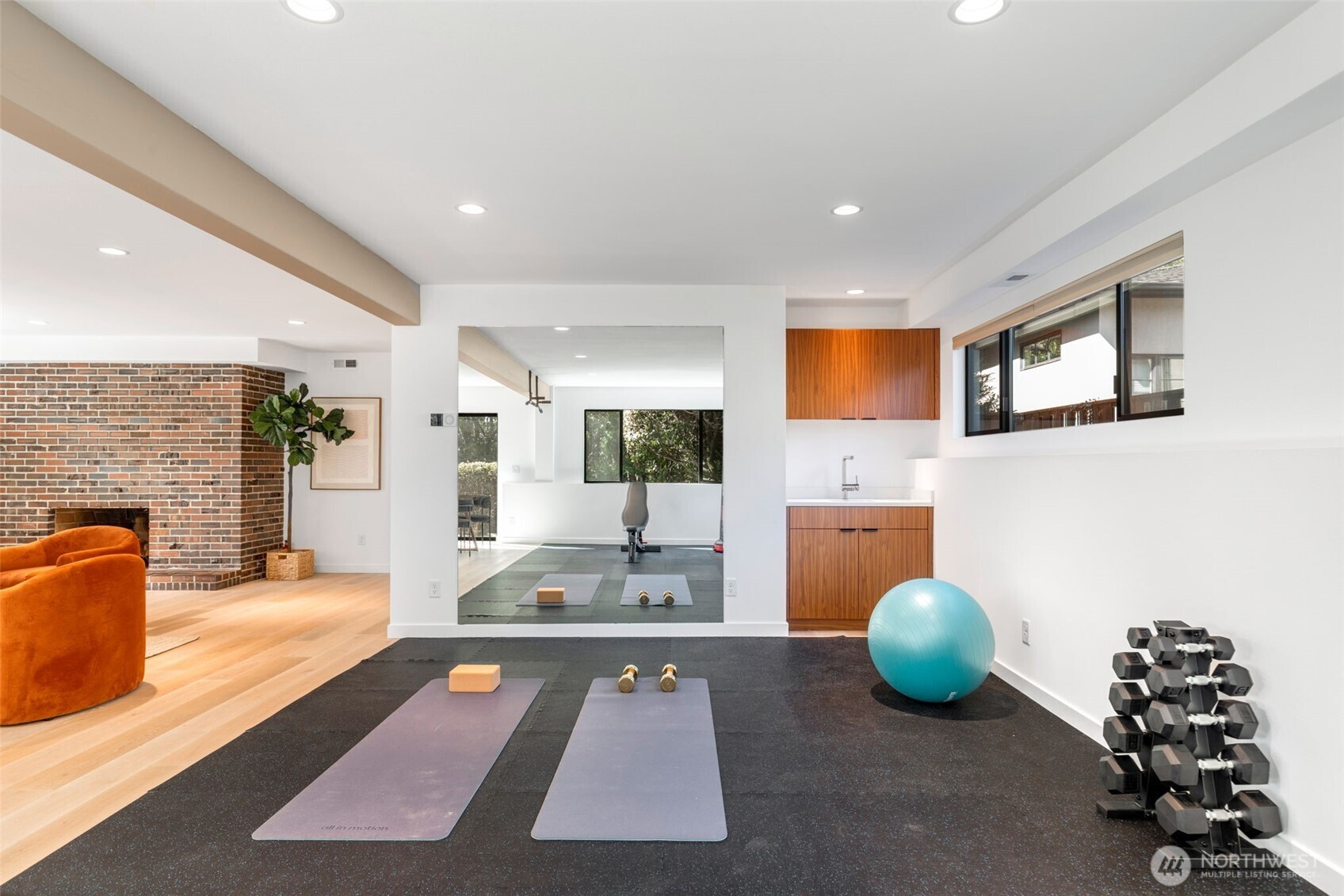 6667 Northeast Windermere Road Seattle, WA 98115 - Photo 32 of 40 a living room with furniture and a flat screen tv