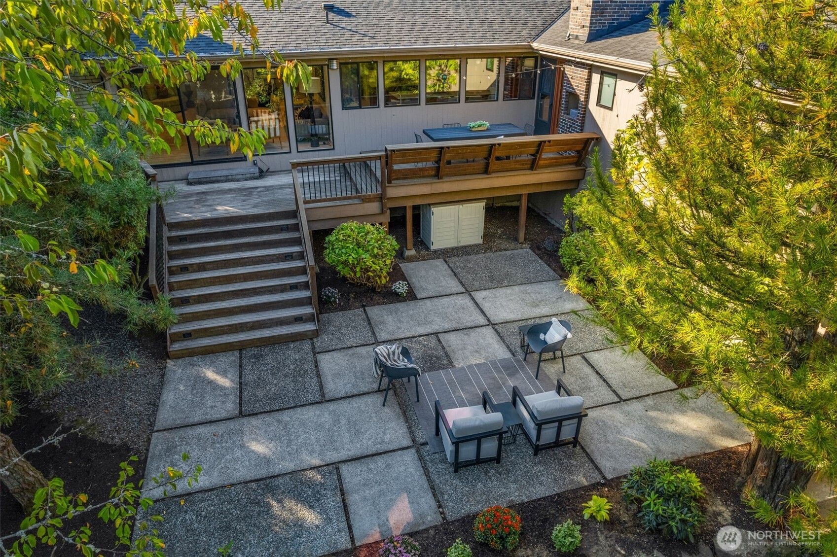 6667 Northeast Windermere Road Seattle, WA 98115 - Photo 34 of 40 a view of a chairs and table in a backyard
