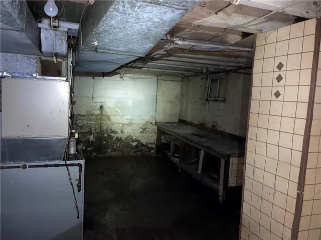 a bathroom with a shower and a sink