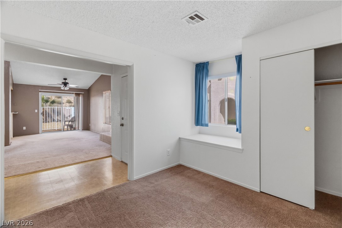 2124 Pebble Creek Lane Laughlin, NV 89029 - Photo 18 of 54 Second bedroom with carpet, access to outside, and a closet