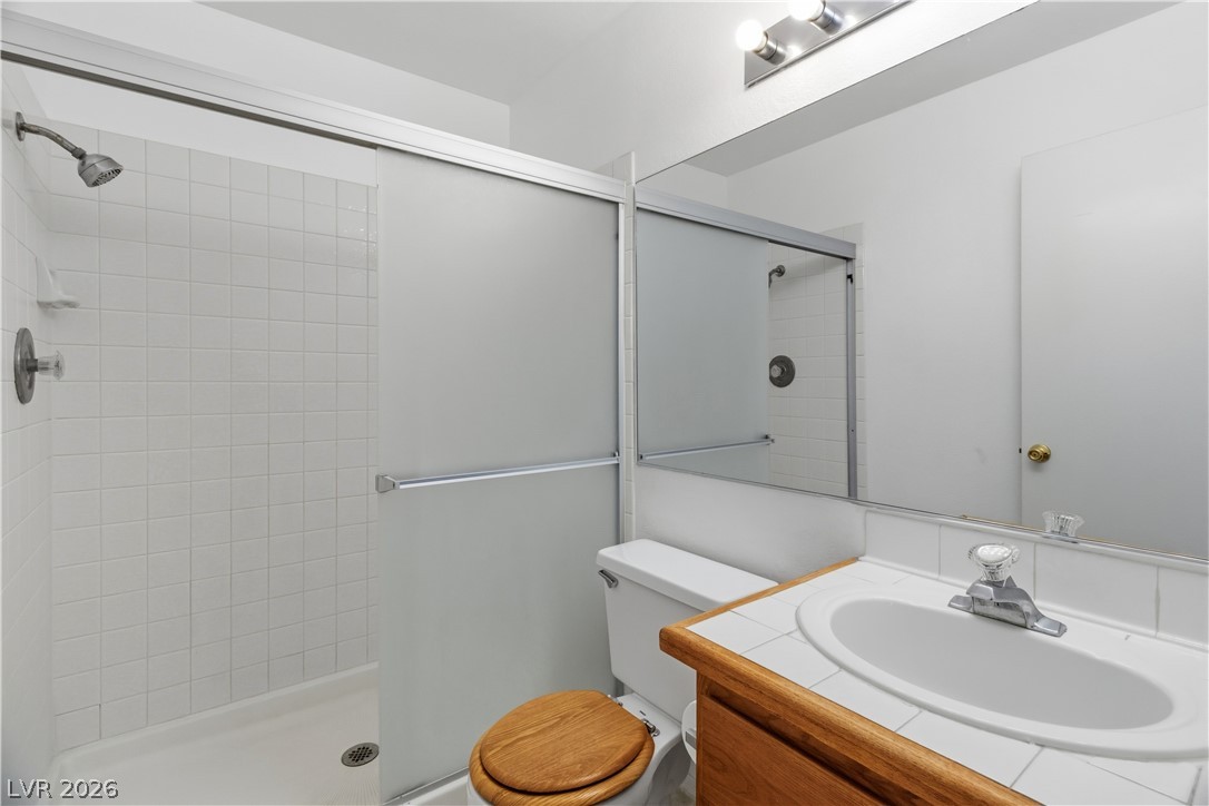 2124 Pebble Creek Lane Laughlin, NV 89029 - Photo 25 of 54 Full Primary bath featuring vanity and a stall shower