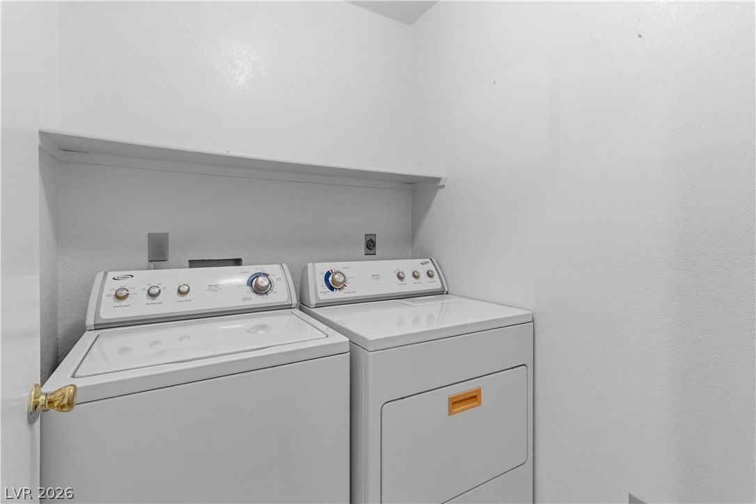 2124 Pebble Creek Lane Laughlin, NV 89029 - Photo 26 of 54 Laundry room featuring separate washer and dryer