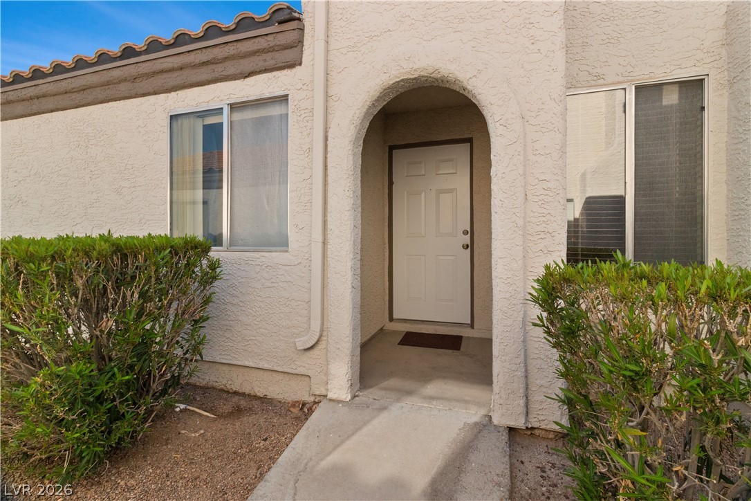 2124 Pebble Creek Lane Laughlin, NV 89029 - Photo 3 of 54 Property entrance featuring stucco siding and a tile roof