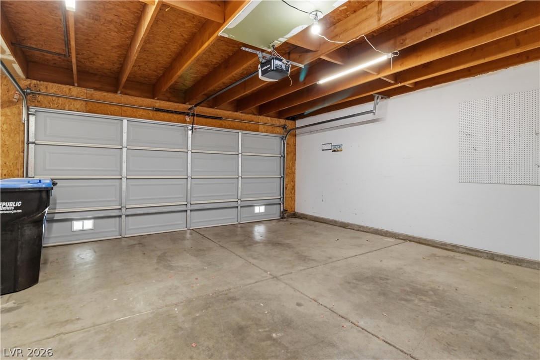 2124 Pebble Creek Lane Laughlin, NV 89029 - Photo 32 of 54 Garage with a garage door opener and baseboards