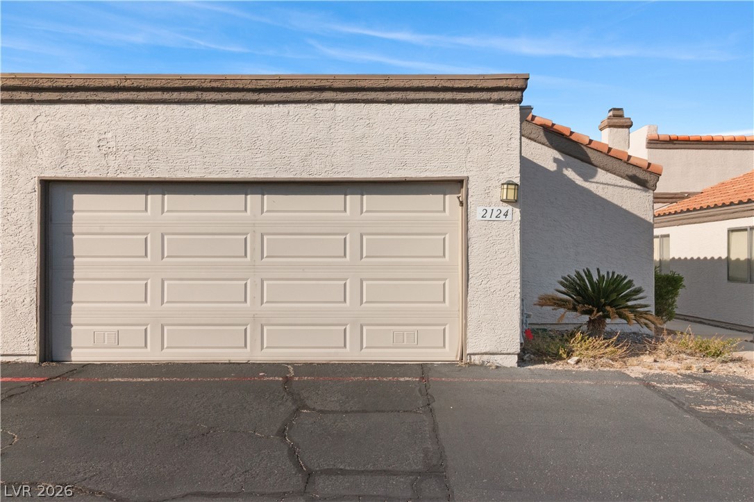 2124 Pebble Creek Lane Laughlin, NV 89029 - Photo 44 of 54 Garage featuring driveway