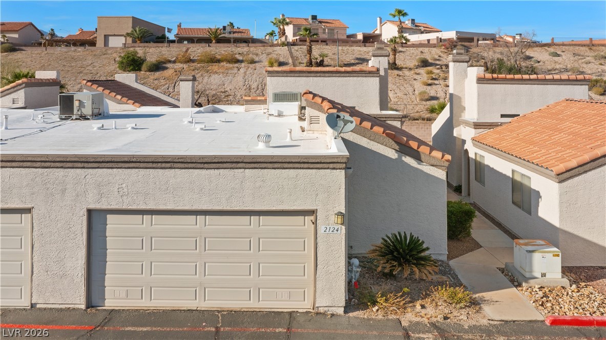 2124 Pebble Creek Lane Laughlin, NV 89029 - Photo 45 of 54 View of front facade with stucco siding and a residential view
